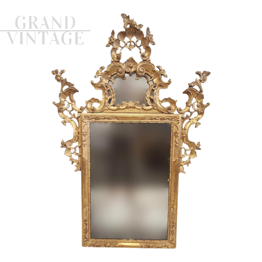 Large Venetian Louis XV style mirror in carved and gilded wood