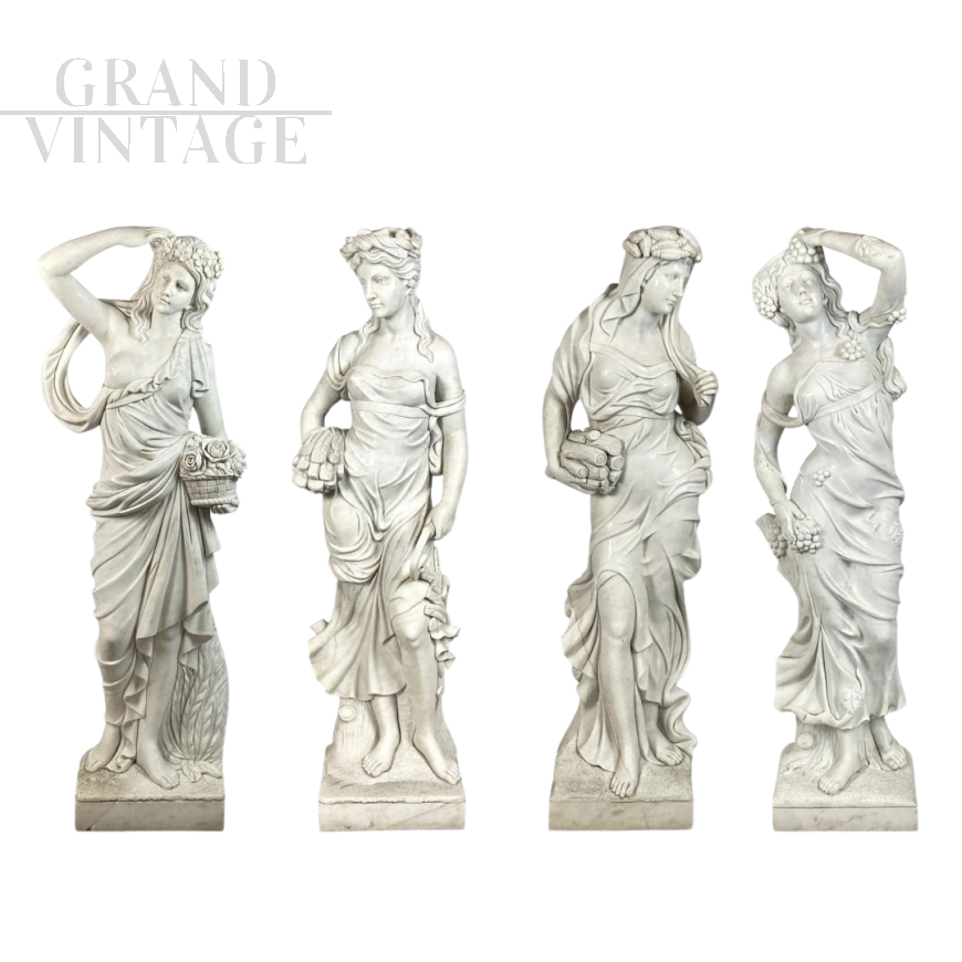 Group of 4 statues depicting the Four Seasons in white marble