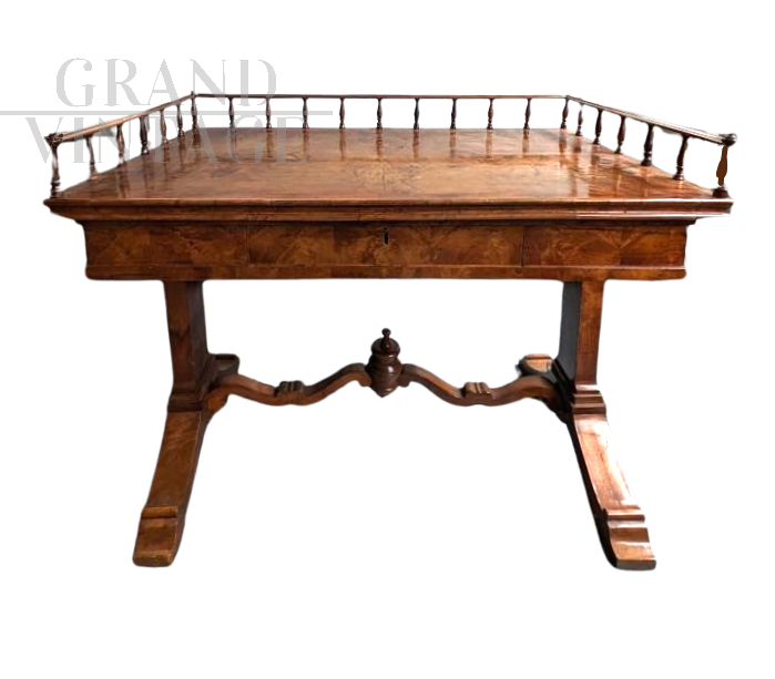 Antique desk in light mahogany with railing on the top      