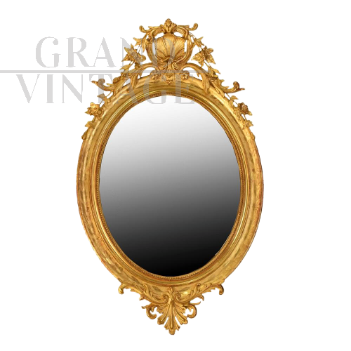 ANTIQUE OVAL MIRROR WITH GOLDEN FRAME, 19th CENTURY.