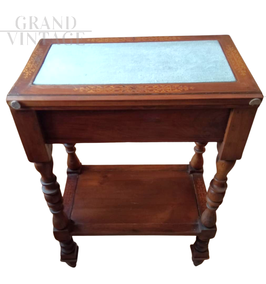 Antique inlaid coffee table with light blue velvet top       